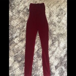 One piece burgundy body suit